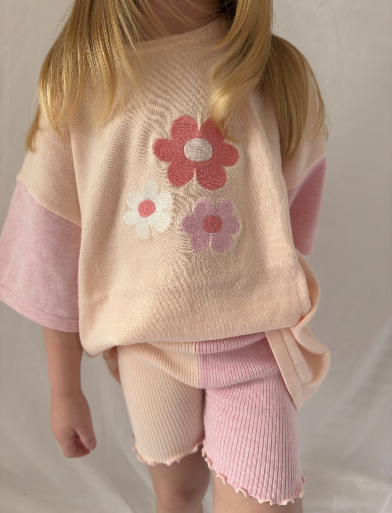 Girls pink oversized top and bike shorts matching outfit