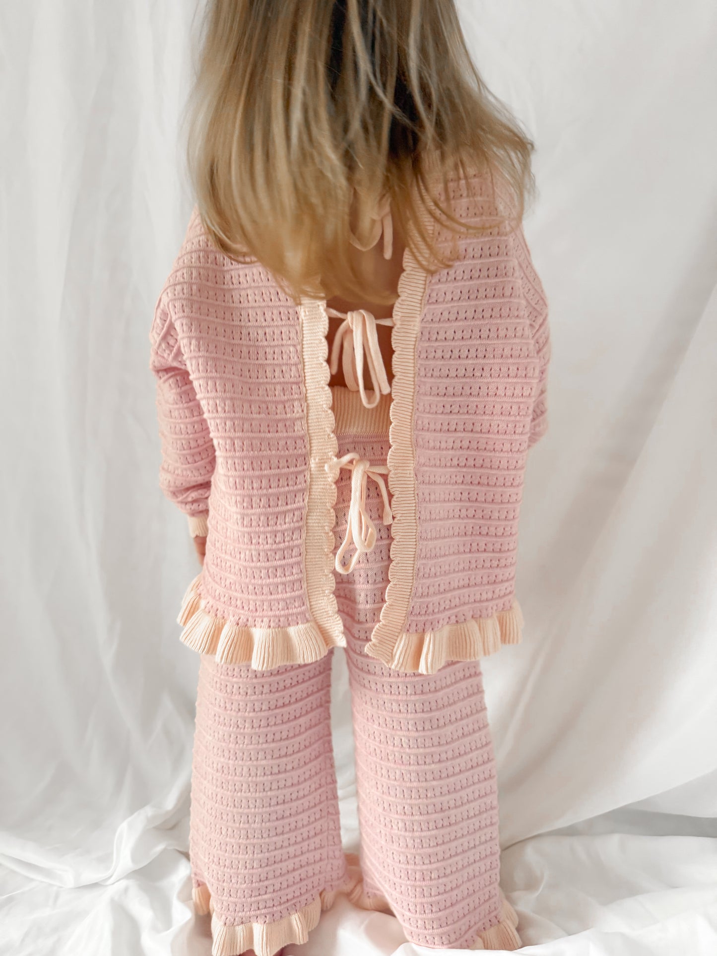 Unique, beautiful girls pink jumper with tie back detail. Matching trousers. Matching outfit